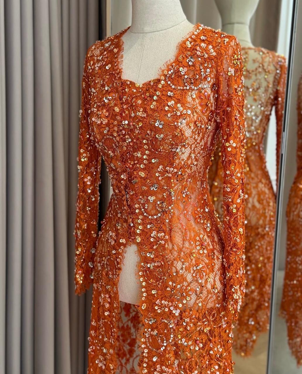 Orange Kebaya by Ronauli Liu
