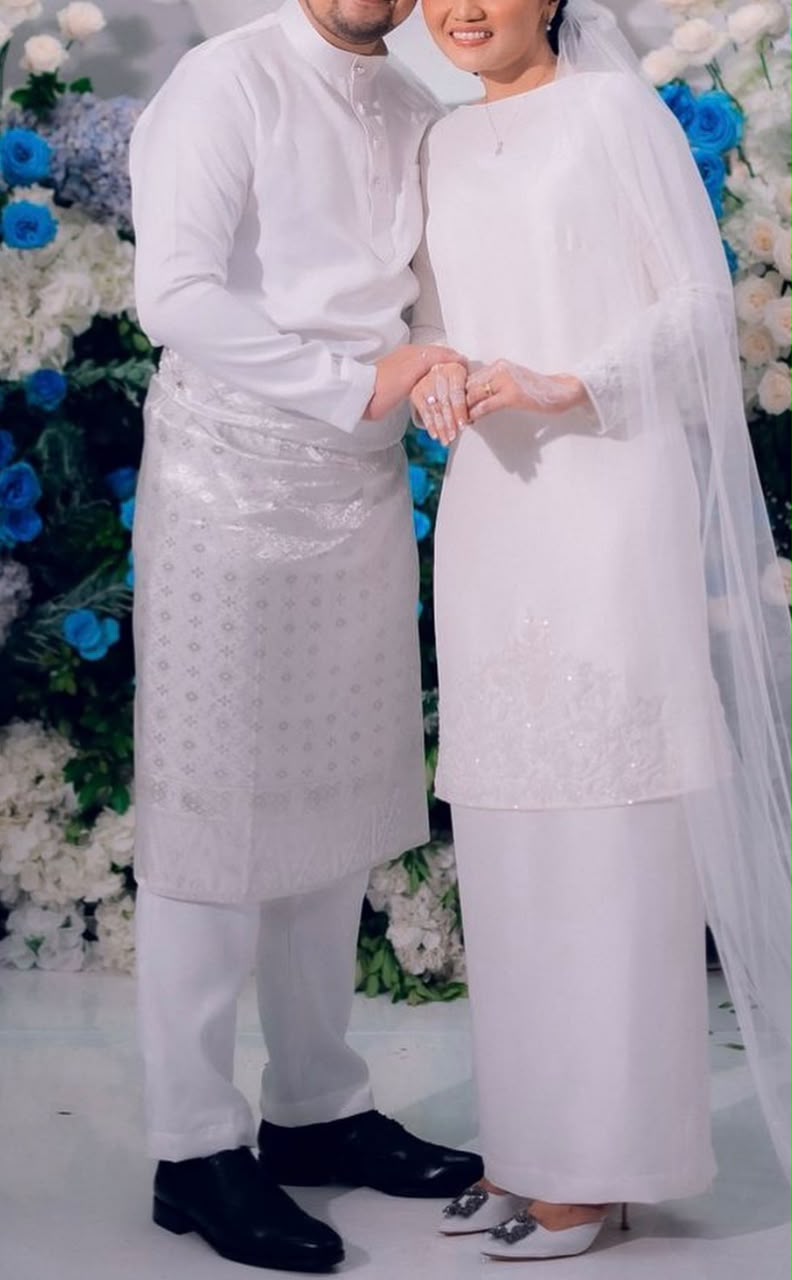 White Attire by Hazeq Rahman